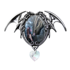 A gothic dragon wing brooch in silver-tone metal, featuring an oval inset with a fantasy illustration of a woman and a dragon, and a dangling heart-shaped iridescent crystal.