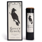 Candle packaging with a raven design labeled 'Raven's Remedy' on a white background