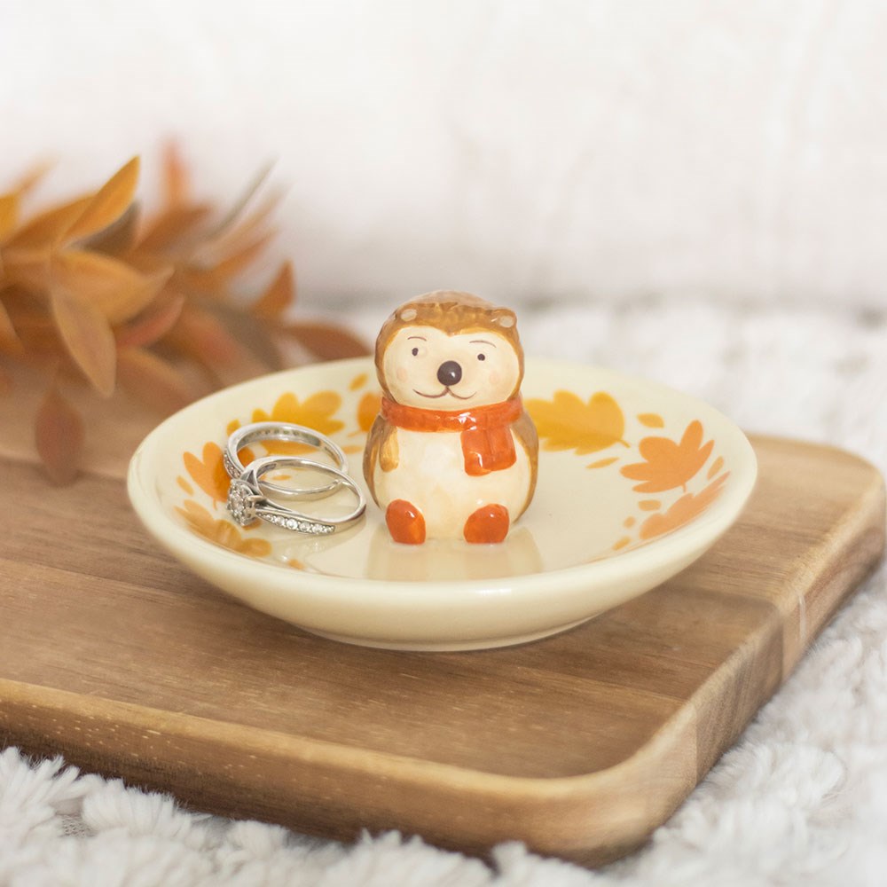Ring dish with a cute animal design on a wooden surface