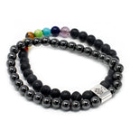 Black beaded bracelet with a silver clasp on a white background