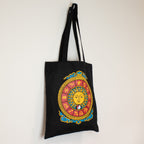 Black tote bag with colorful zodiac design on a white background