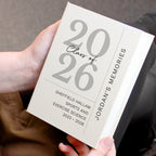 Book titled '2026 Class of 2026Jordan's Memories' held by a person.