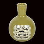 Green bottle-shaped container with a label on a white background