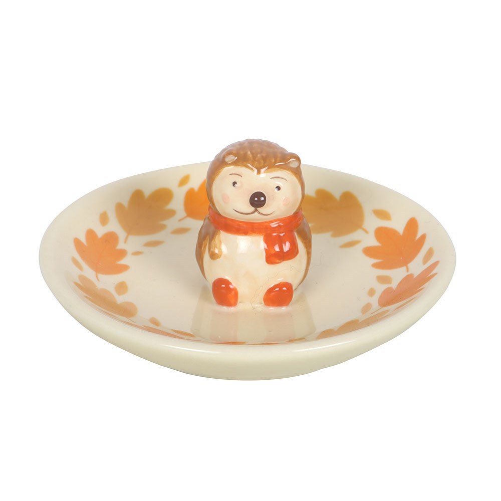 Decorative dish with a hedgehog figurine on a white background