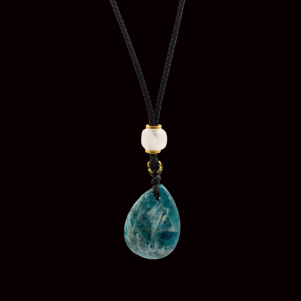 Necklace with a blue teardrop pendant and black cord on a white background