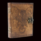 Decorative leather-bound book with dragon design and latch on a white background