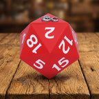 Red polyhedral dice with white numbers on a white background