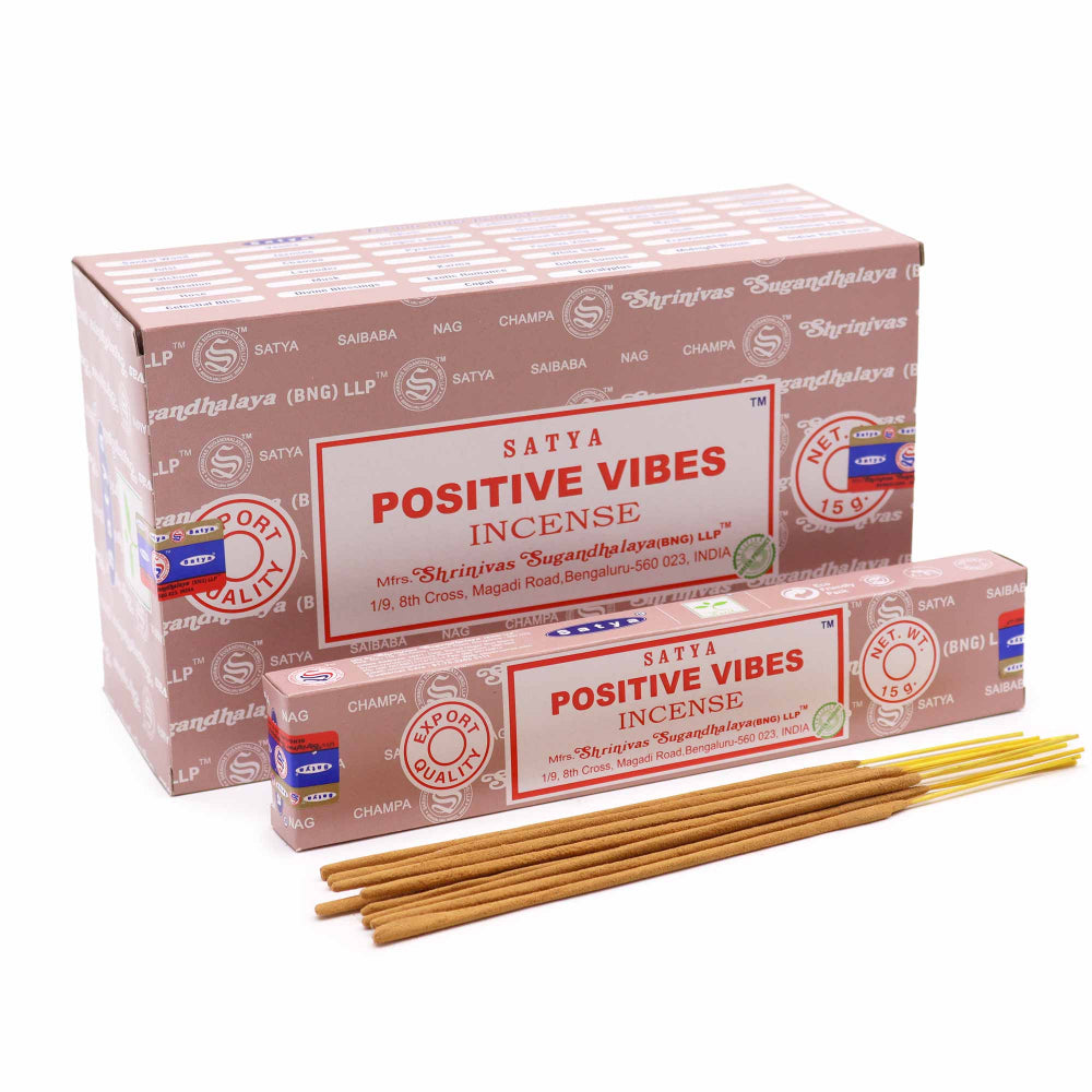 Satya Positive Vibes incense packaging with incense sticks on a white background