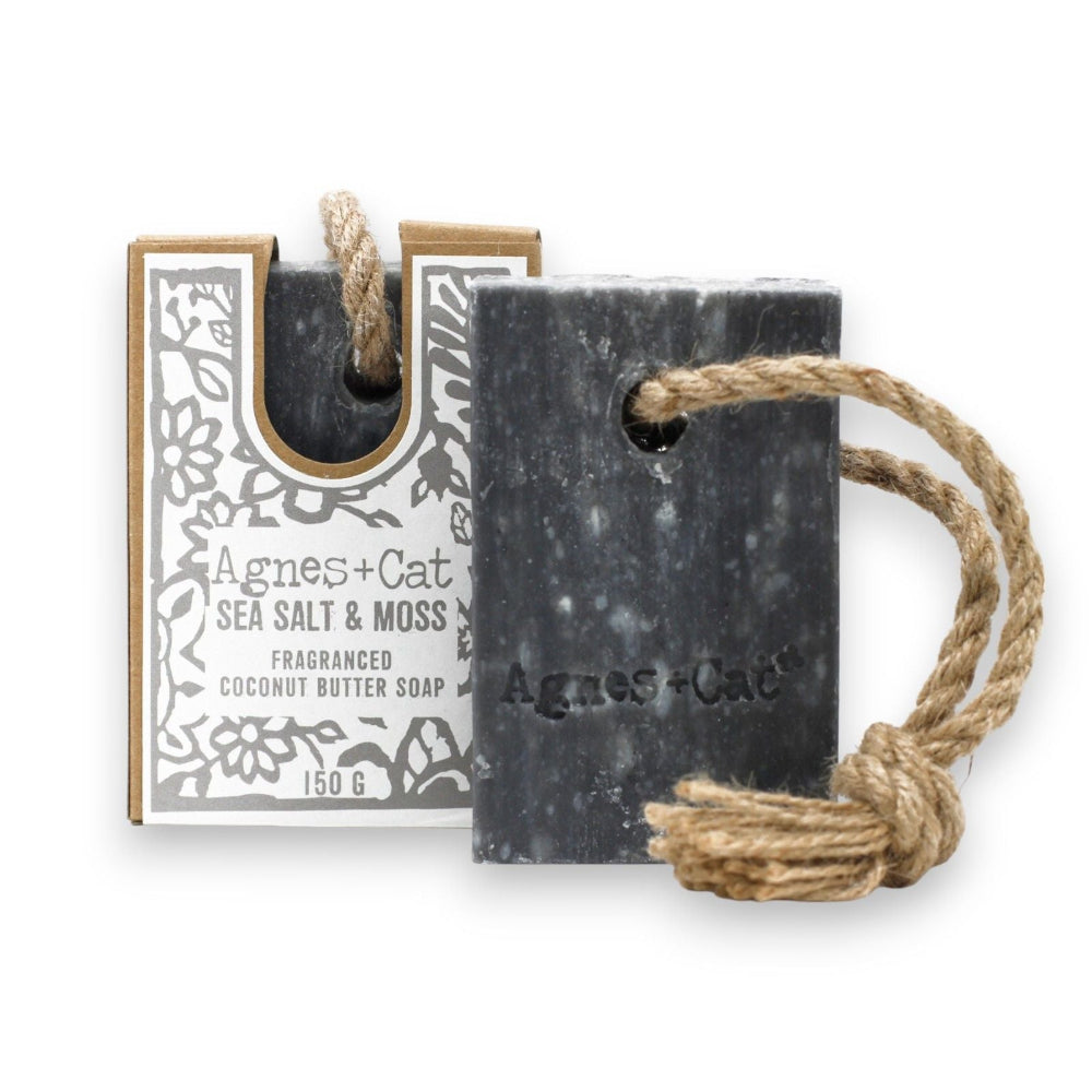 Black soap bar with rope and Agnes & Cat packaging on a white background