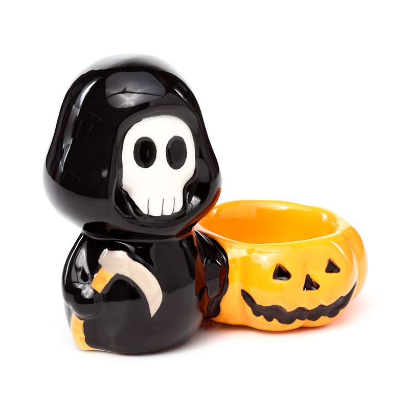 Black grim reaper-shaped container with a pumpkin-shaped lid on a white background
