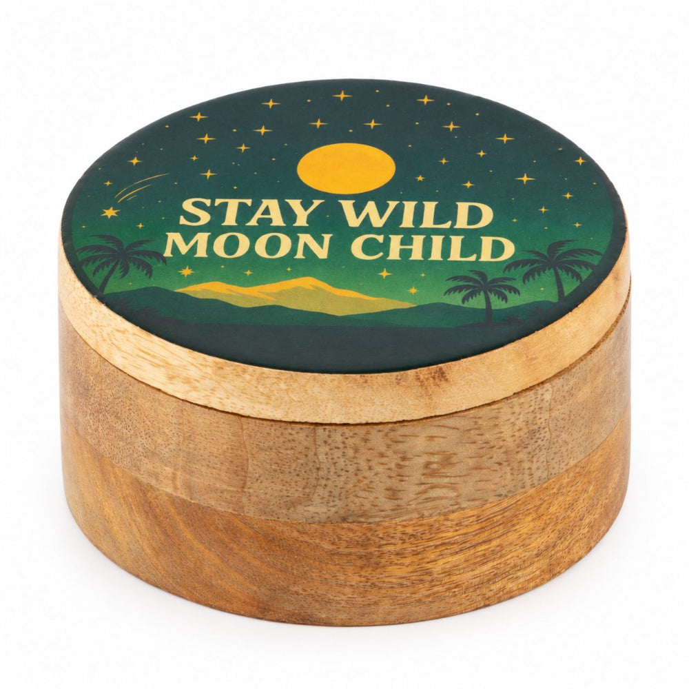A round wooden keepsake box with a lid featuring a printed moon phase illustration and the text 'STAY WILD MOON CHILD' in cream lettering, shown on a plain white background.