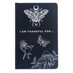 Black notebook with a nature-themed design and the wording I am thankful for.