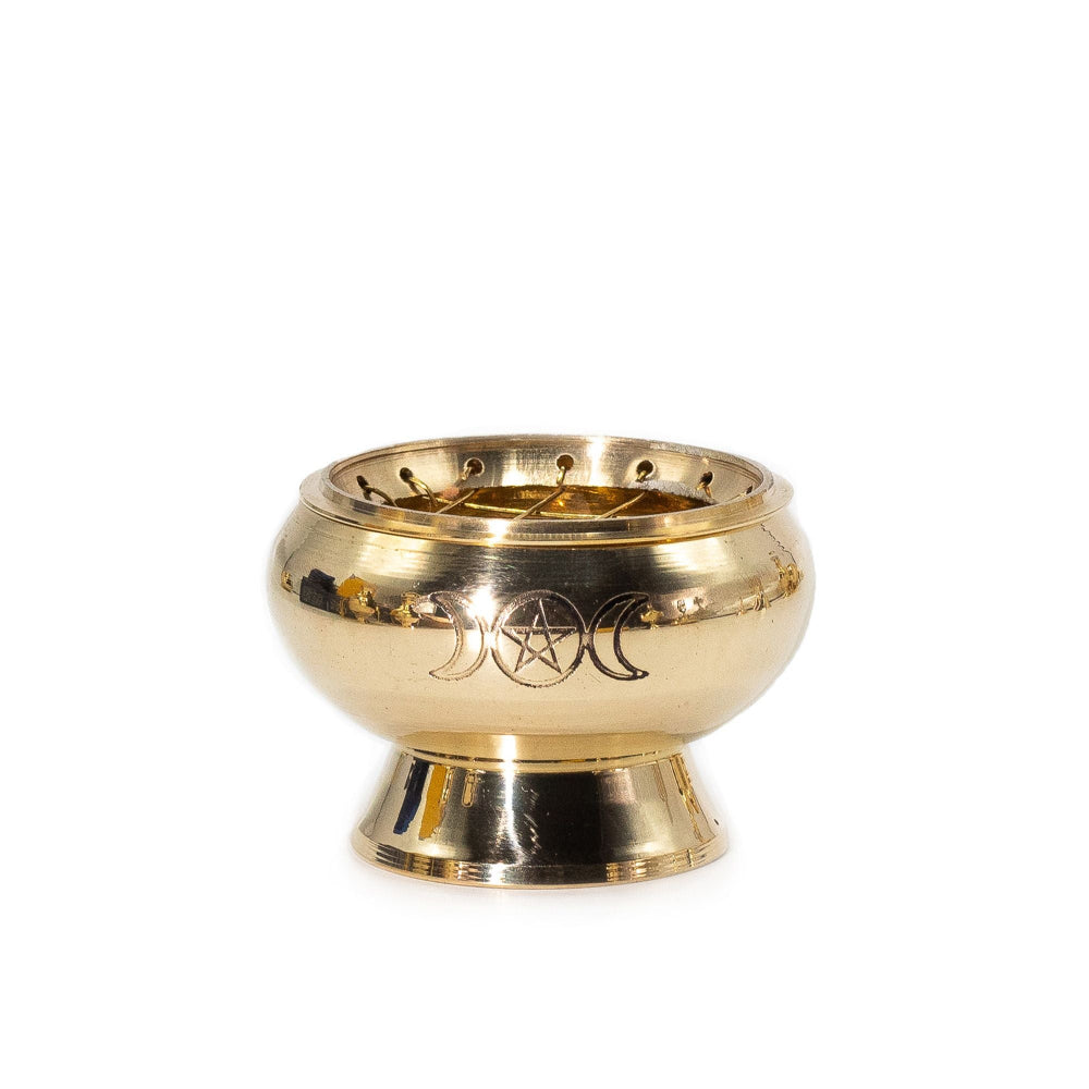 Gold-colored bowl with pentacle and moon designs on a white background