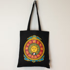Black tote bag with colorful zodiac design on a white background