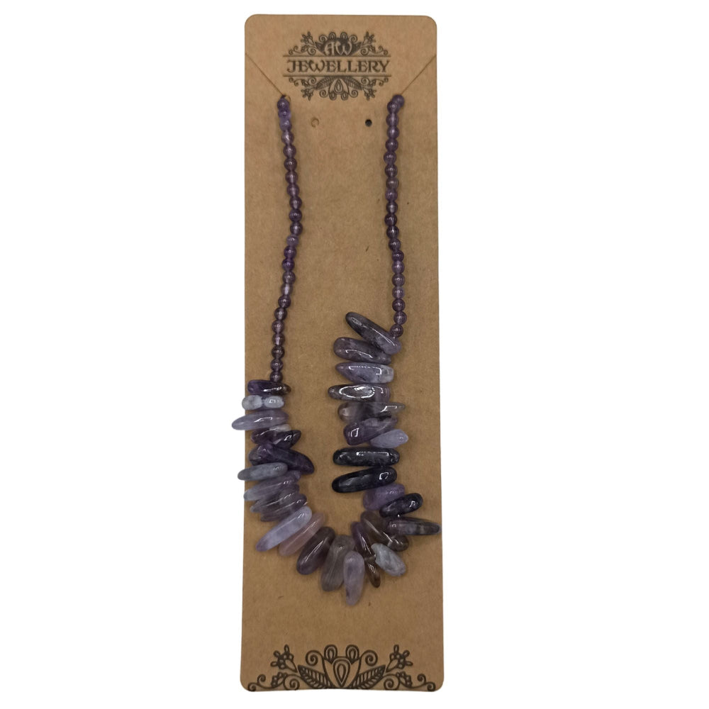 Necklace with purple stones on a brown jewelry card