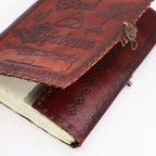 Brown leather notebook with embossed designs on a white background