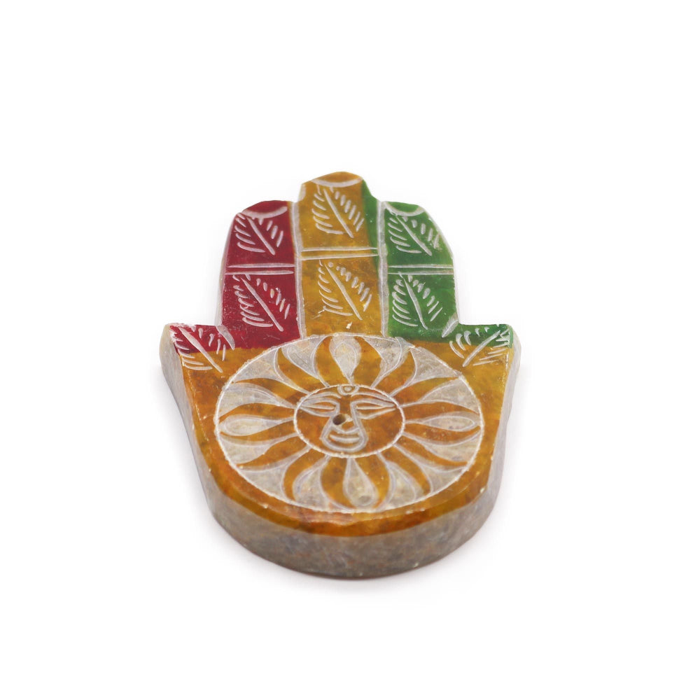 Decorative stone with colorful leaf patterns on a white background