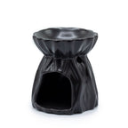 Black ceramic oil burner on a white background