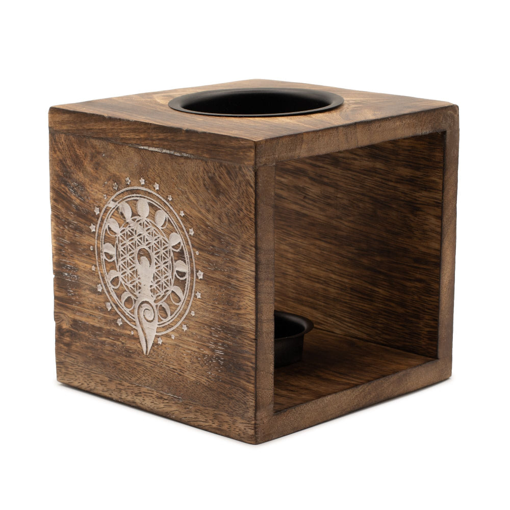 Wooden cube with decorative emblem on a white background