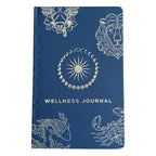 Blue wellness journal with white astrological symbols on a white background