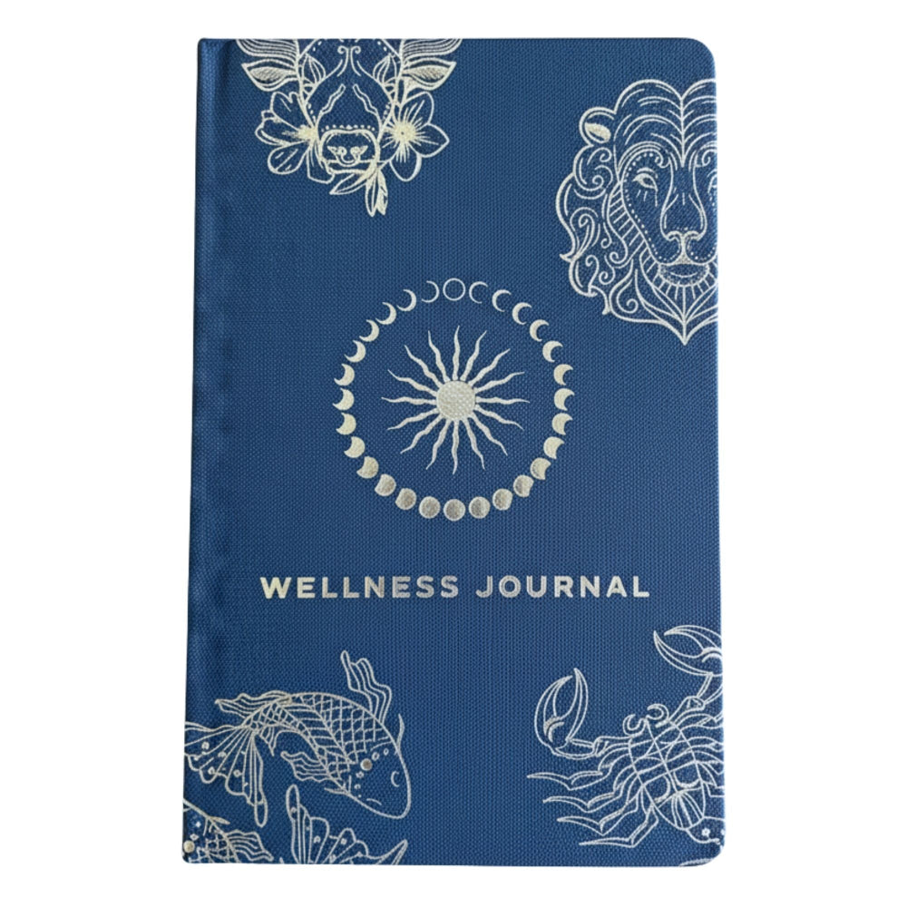 Blue wellness journal with white astrological symbols on a white background