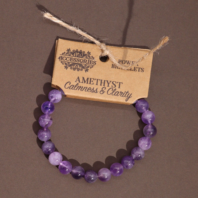 Purple beaded bracelet on a brown background with a label