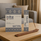 Indus Treasures MATTIPAL incense packaging on a table with an incense stick.
