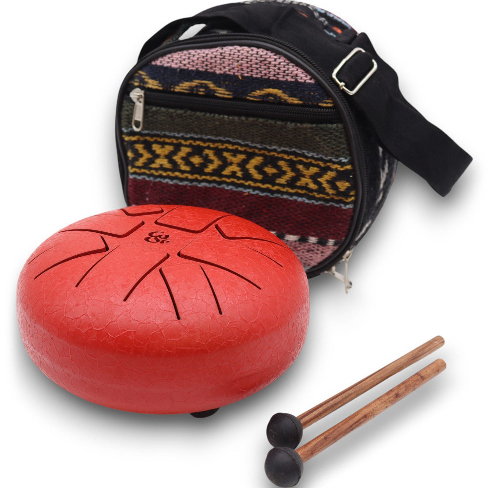 Red hand drum with patterned bag and mallets on a white background