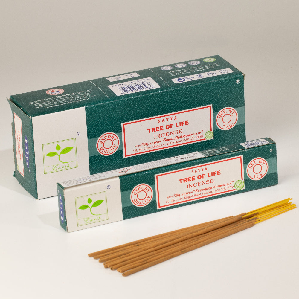 Two boxes of Satya Tree of Life Incense with several brown incense sticks placed in front on a clean white studio background.
