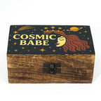 Wooden box with 'Cosmic Babe' design on a black lid