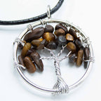 Tree of Life pendant with brown stones and silver wire wrapping on a white background