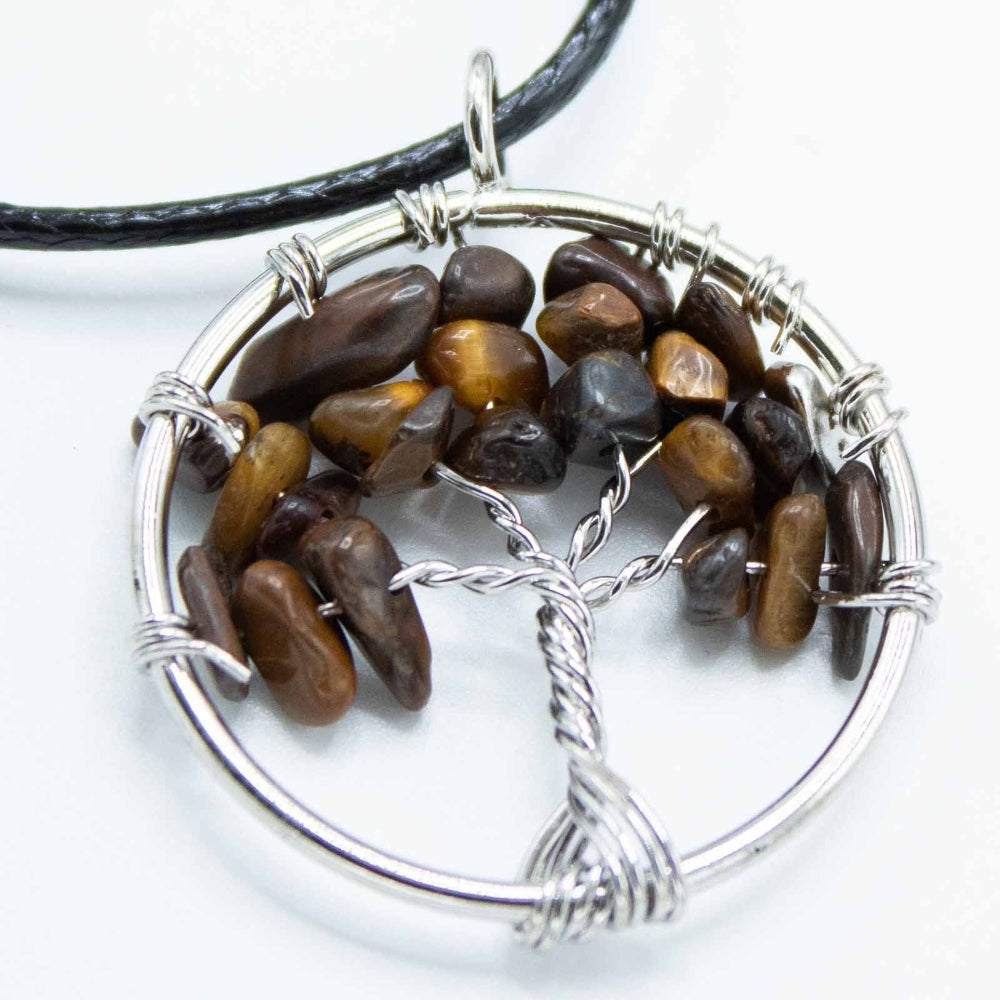 Tree of Life pendant with brown stones and silver wire wrapping on a white background