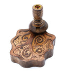 Wooden incense holder with intricate carvings on a white background