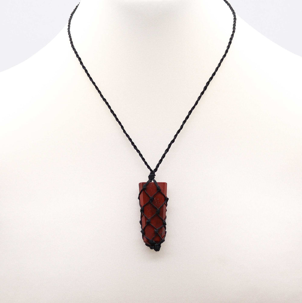 Necklace with a red pendant on a white background