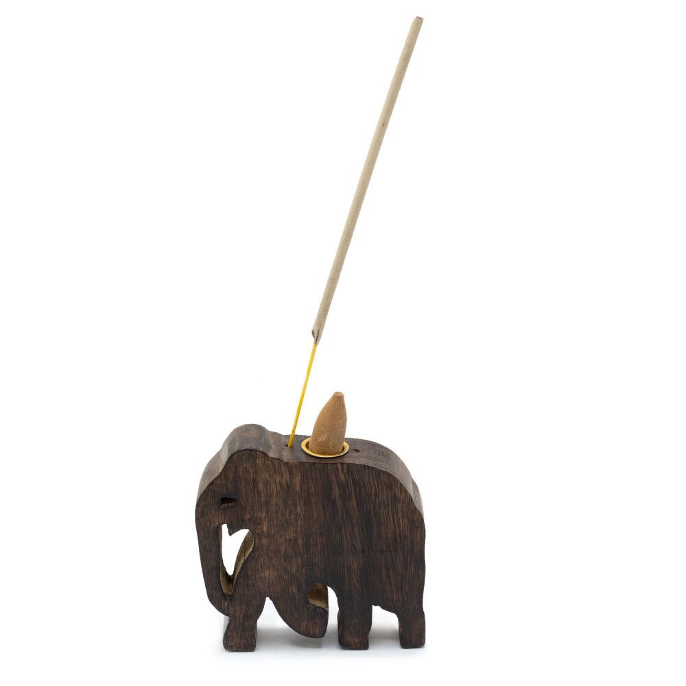 Wooden elephant incense burner with a stick of incense on a white background