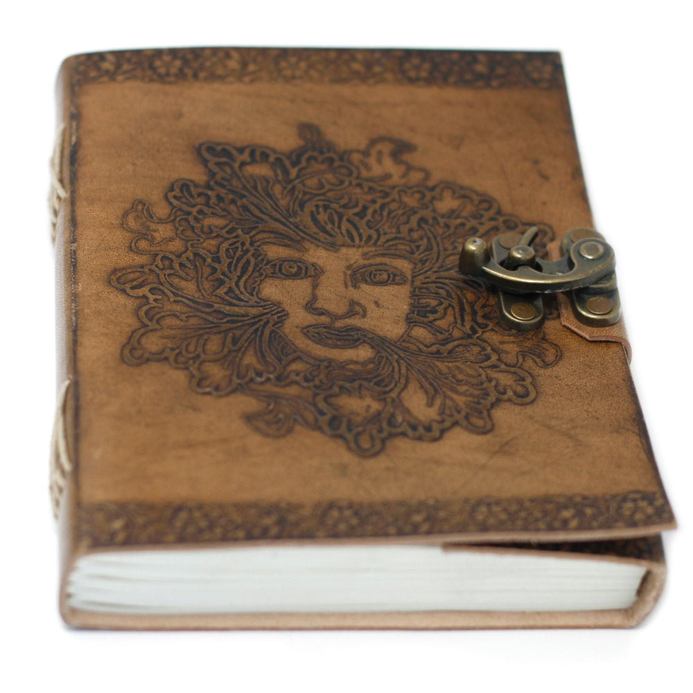 Brown leather notebook with embossed design and metal clasp on a white background