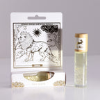 Product packaging with a lion illustration and a glass bottle with a wooden cap on a gray background