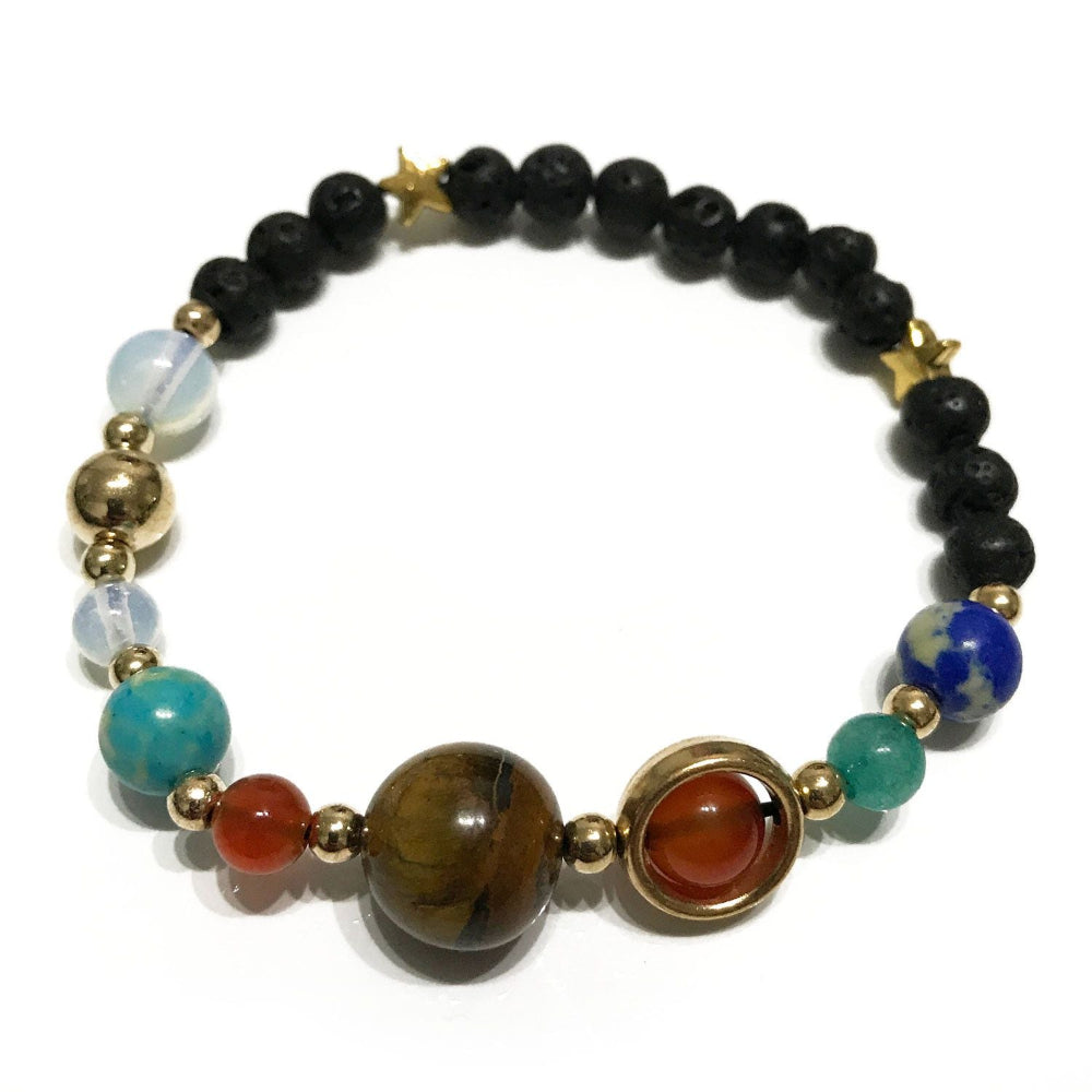Multicolored beaded bracelet with gold accents on a white background