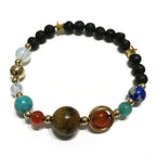 Multicolored beaded bracelet with gold accents on a white background