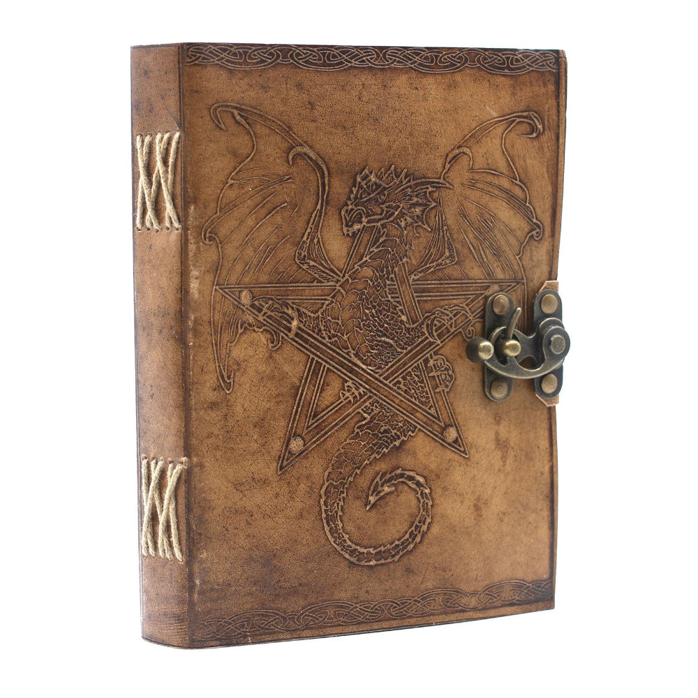 Decorative leather-bound book with dragon design and latch on a white background
