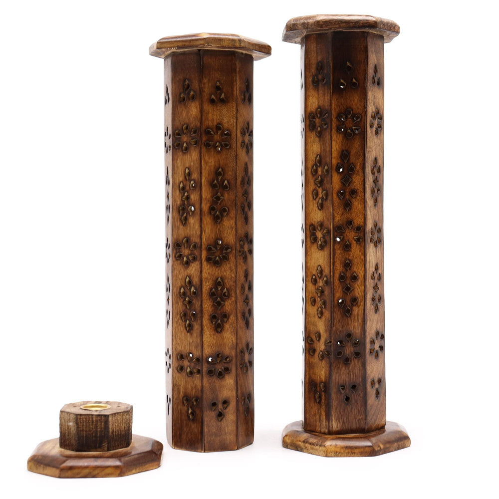 Two wooden incense holders with intricate carvings on a white background