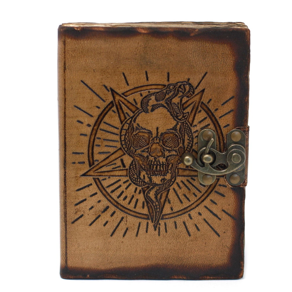 Brown leather journal with skull and snake design on a white background