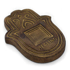 Bronze-colored decorative item with 'HEALING' text on a white background