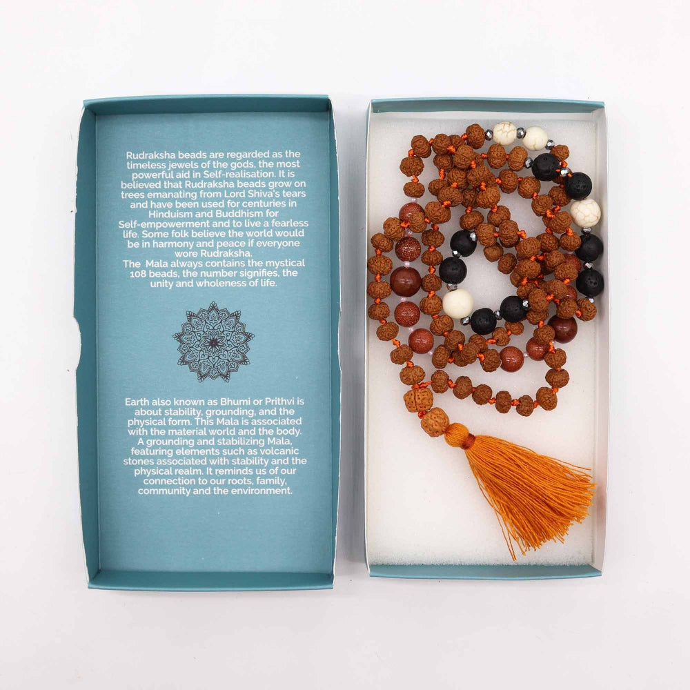 Mala beads with tassel in a box with descriptive text on a white background