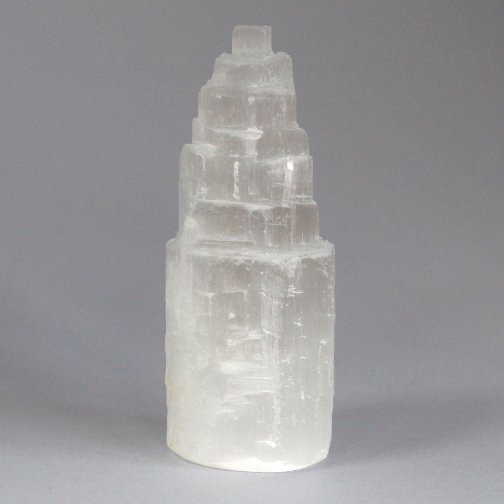 Clear crystal tower on a gray background