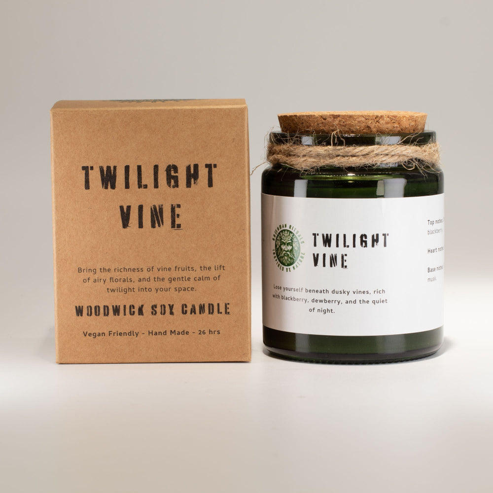 Woodwick candle labeled 'Twilight Vine' with packaging on a light gray background