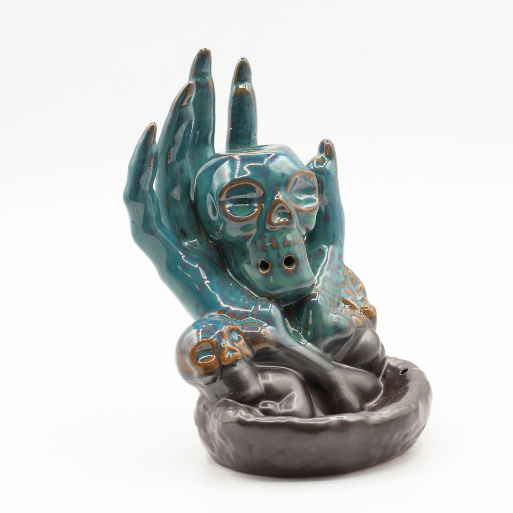 Skull in Hand Backflow Incense Burner
