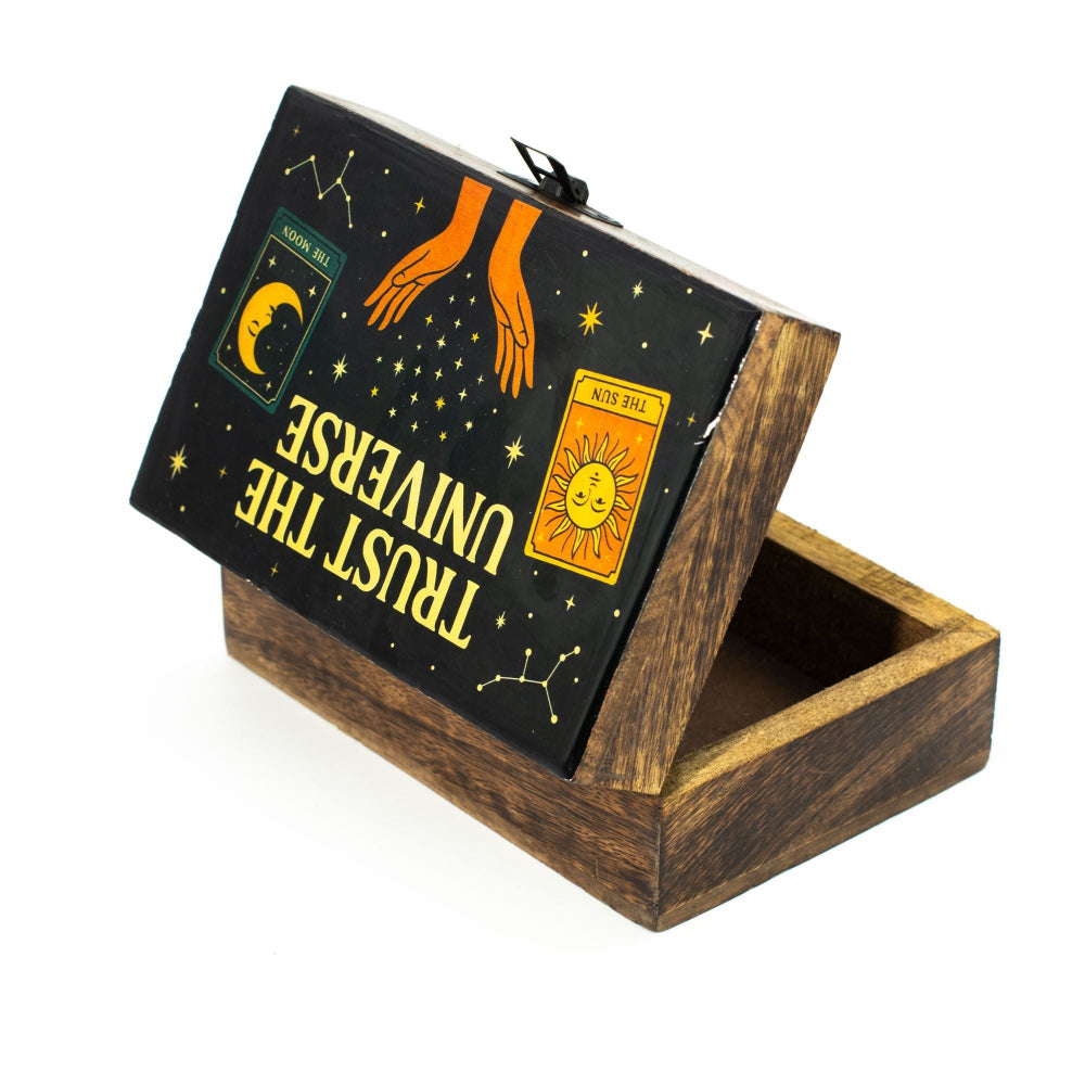 Wooden box with a black cover featuring tarot card designs and text.
