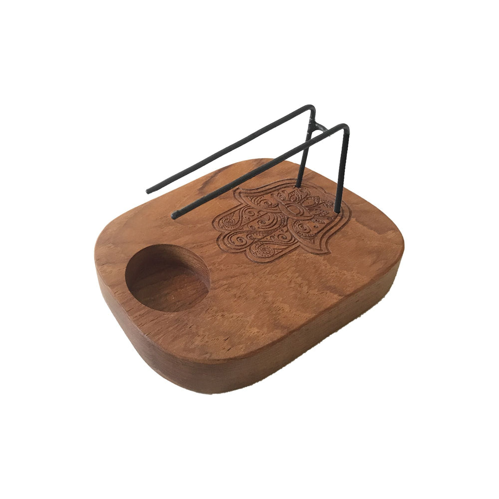 Wooden tray with embossed design and metal stand on a white background