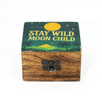 Wooden box with 'Stay Wild Moon Child' design on a white background